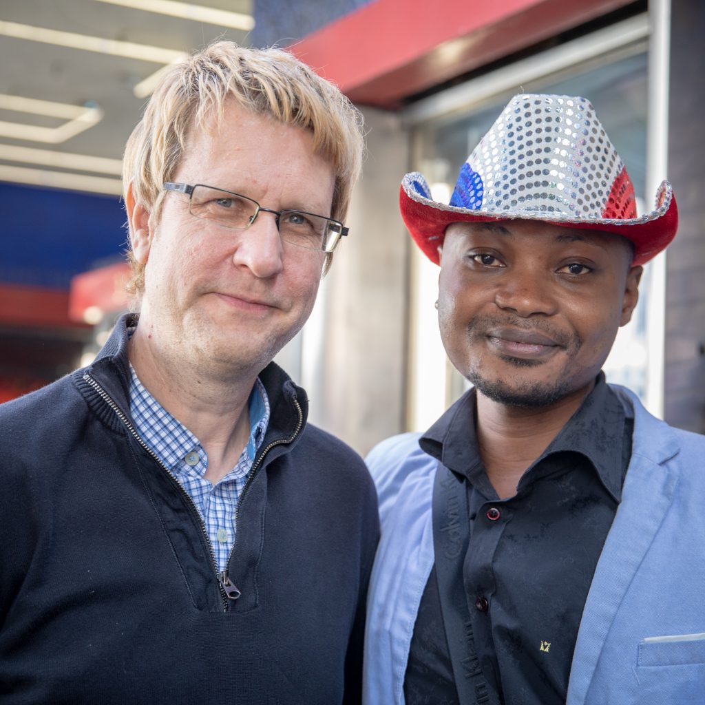 Filmmaker Tom Shepherd (left) with Guardian Group client Junior Mayema